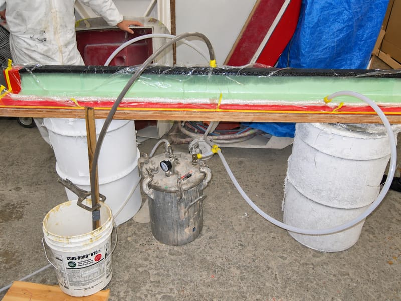Vacuum infusion bag and resin lines on a part